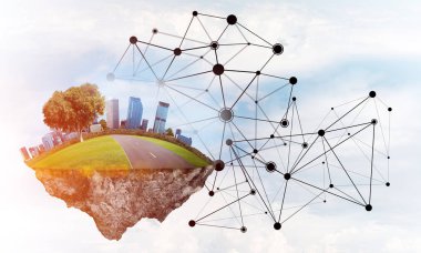 Gökyüzünde yükselen çimen ve şehir manzaralı güzel küçük bir ada.