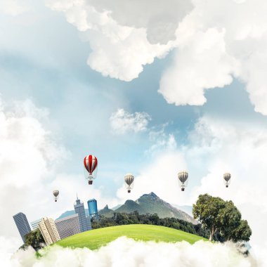 Kent manzaralı kule ve gökdelen yeşil uçan ada. Aerostates ve mavi bulutlu gökyüzü arka plan üzerinde uçan. 