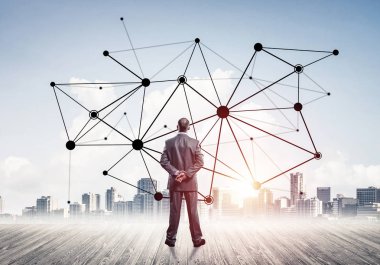 İşadamı arkasını kolluyor ve ağ çizimi kavramına bakıyor