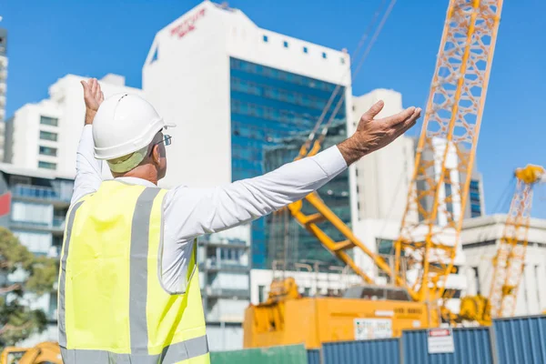 man controlling outdoor construction site