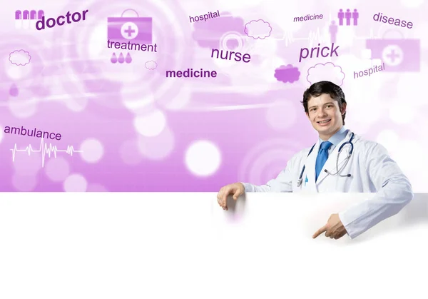 Doctor holding white blank banner — Stock Photo, Image