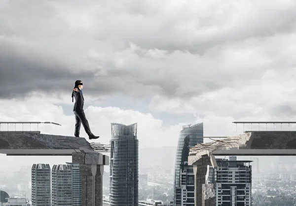 Businessman walking blindfolded — Stock Photo, Image