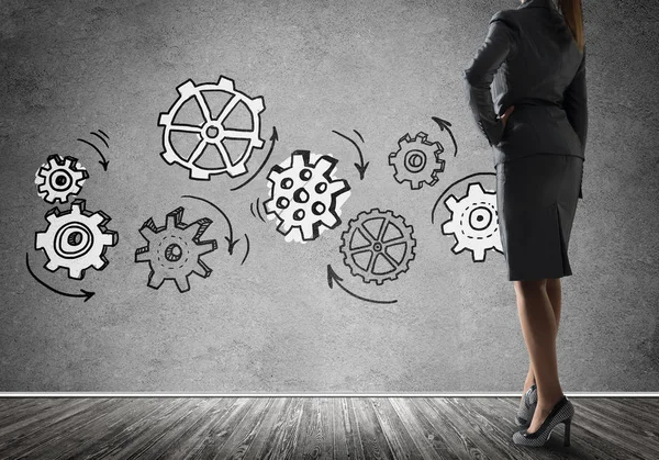 Bottom View Businesswoman Standing Front Wall Drawn Gears Mechanism Teamwork — Stock Photo, Image