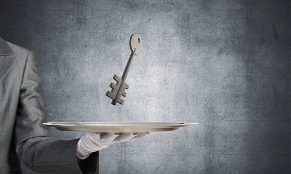 Waiter's hand in white glove — Stock Photo, Image