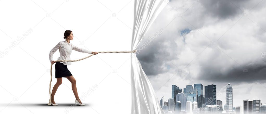 Businesswoman pulling white blank fabric