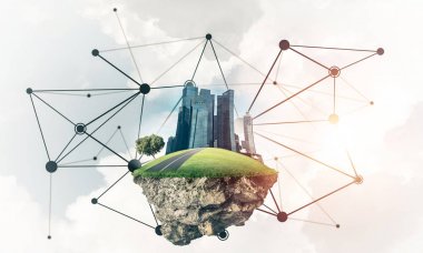 Gökyüzünde yükselen çimen ve şehir manzaralı güzel küçük bir ada.