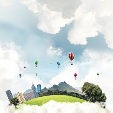 Kent manzaralı kule ve gökdelen yeşil uçan ada. Aerostates ve mavi bulutlu gökyüzü arka plan üzerinde uçan. 
