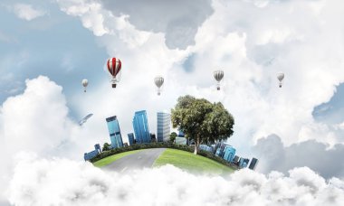 Kent manzaralı kule ve gökdelen yeşil uçan ada. Aerostates ve mavi bulutlu gökyüzü arka plan üzerinde uçan. 