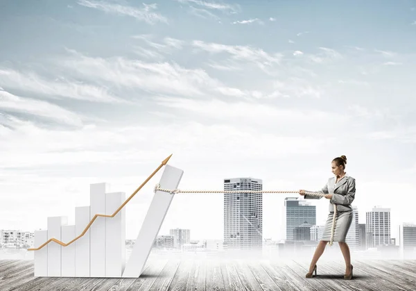 Businesswoman pulling graph with rope as concept of power and control — Stock Photo, Image