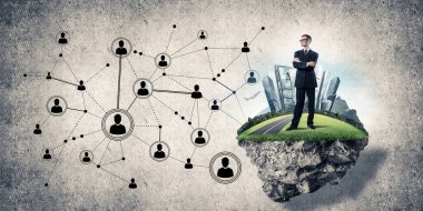 Beton çerçevede, modern kablosuz teknolojileri kavramı yeşil Adası üzerinde zarif işadamı