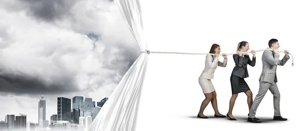 Three Business People Pulling White Blank Fabric Rope Showing Citycscape — Stock Photo, Image