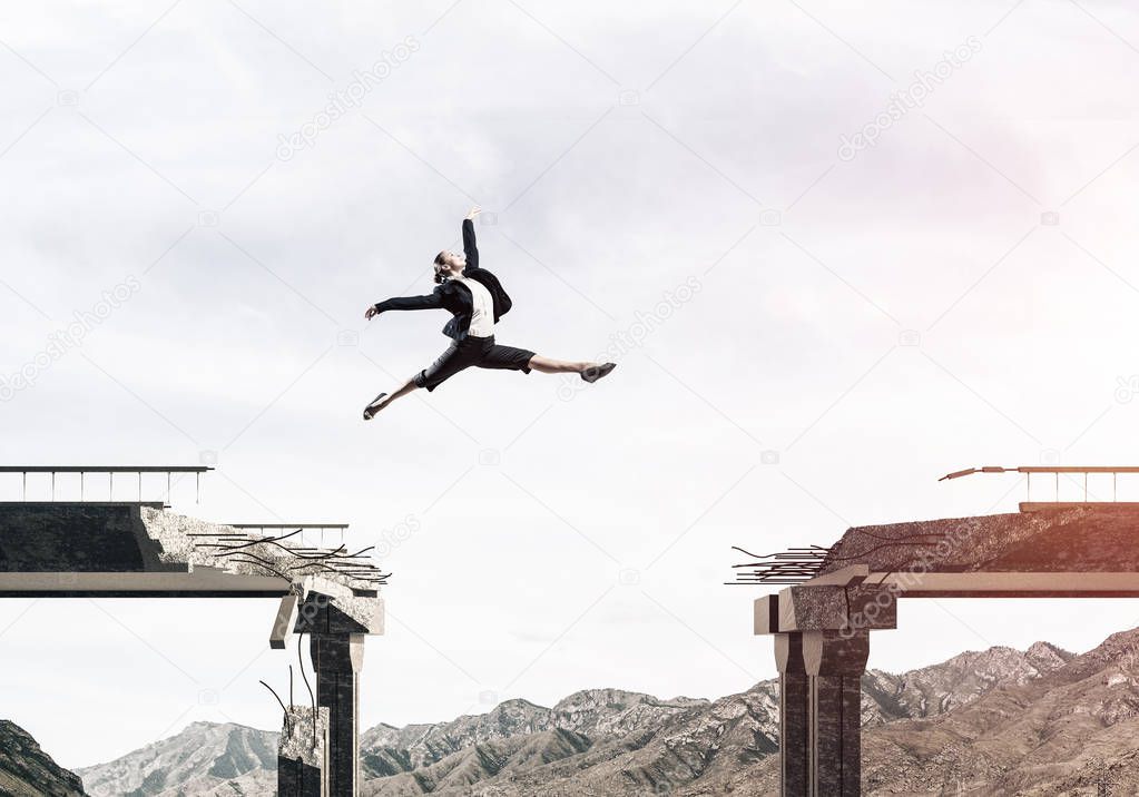woman jumping over huge gap