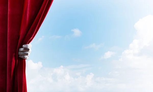 Human Hand Glove Opens Red Velvet Curtain Blue Sky Background — Stock Photo, Image