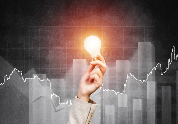 Business Woman Hand Glowing Incandescent Lamp Background Grunge Wall Successful — Stock Photo, Image