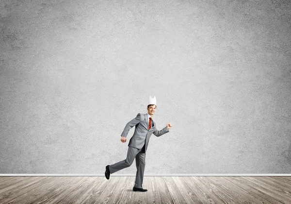 Young Handsome Businessman Wearing White Paper Crown Running Hurry — Stock Photo, Image