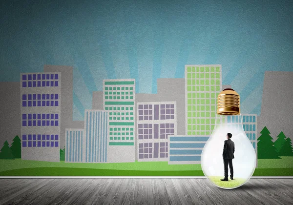 Businessman inside light bulb against city drawn concept