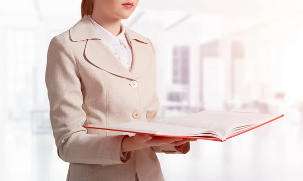 Businesswoman Holding Open Notebook Background Blurred Office Interior Business Paperwork — Stock Photo, Image