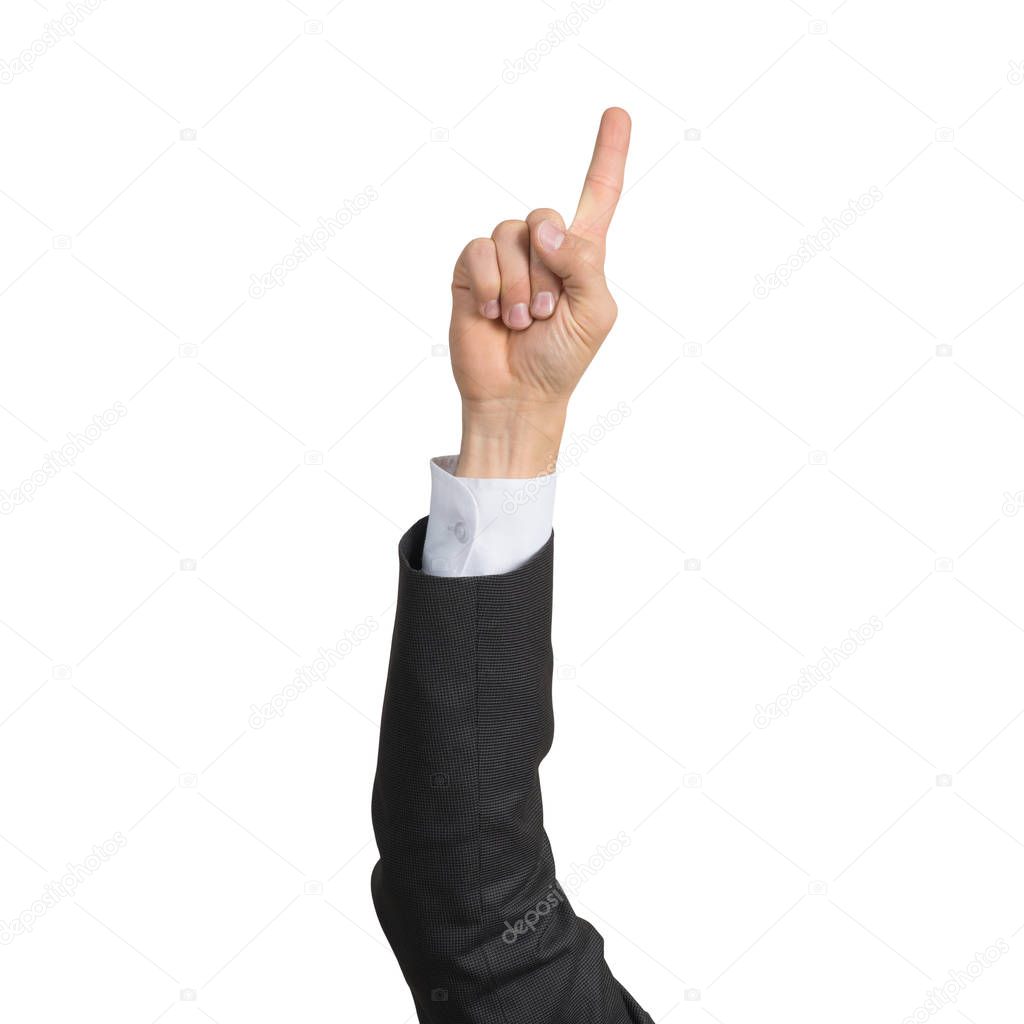 Businessman hand in suit showing finger pointing gesture with forefinger. Human hand gesturing sign isolated on white background studio shot. Businessman raised arm presenting popular gesture.