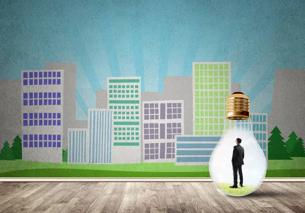 Businessman inside light bulb against city drawn concept