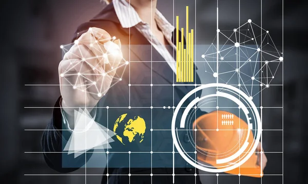 Businesswoman pointing on 3d financial graph. Woman in business suit standing with safety helmet. Digital technology and innovation in construction industry. Business analytics and data statistics.