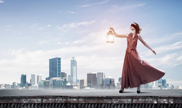 Young Woman Wearing Blindfold Lantern Building Roof Mixed Media — Stock Photo, Image