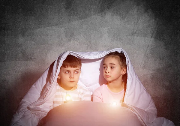 Scared Children Flashlights Lying Bed Little Sister Brother Hiding Blanket — Stock Photo, Image