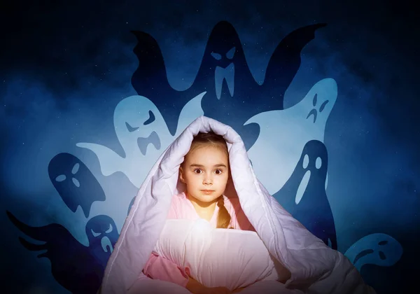 Scared girl hiding under blanket. Startled kid sitting in bed on night sky background. Little girl afraid of dark. Covered child not sleep at night. Fearful girl in pajamas and imaginary monsters.