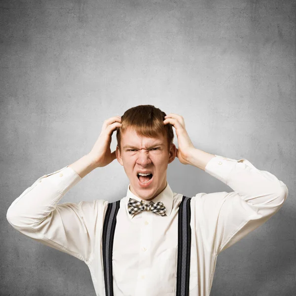 Stressful Teenager Screaming Anger Keeps Hands Head Emotional Redhead Boy — Stock Photo, Image