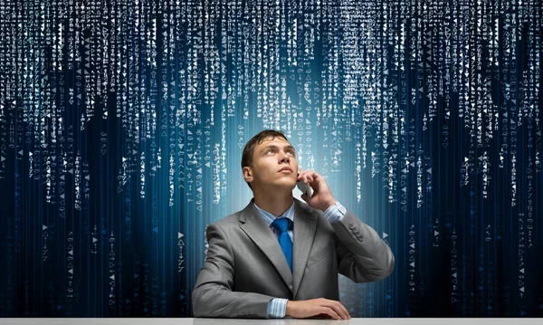 Young Man Talking Phone Looking Upward Businessman Sitting Desk Background — Stock Photo, Image