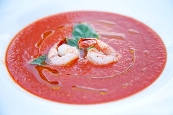 Hot tasty red tomato cream soup with shrimp and prawn on white plate — Stock Image Hot tasty red tomato cream soup with shrimp and prawn on white plate Stock Picture
