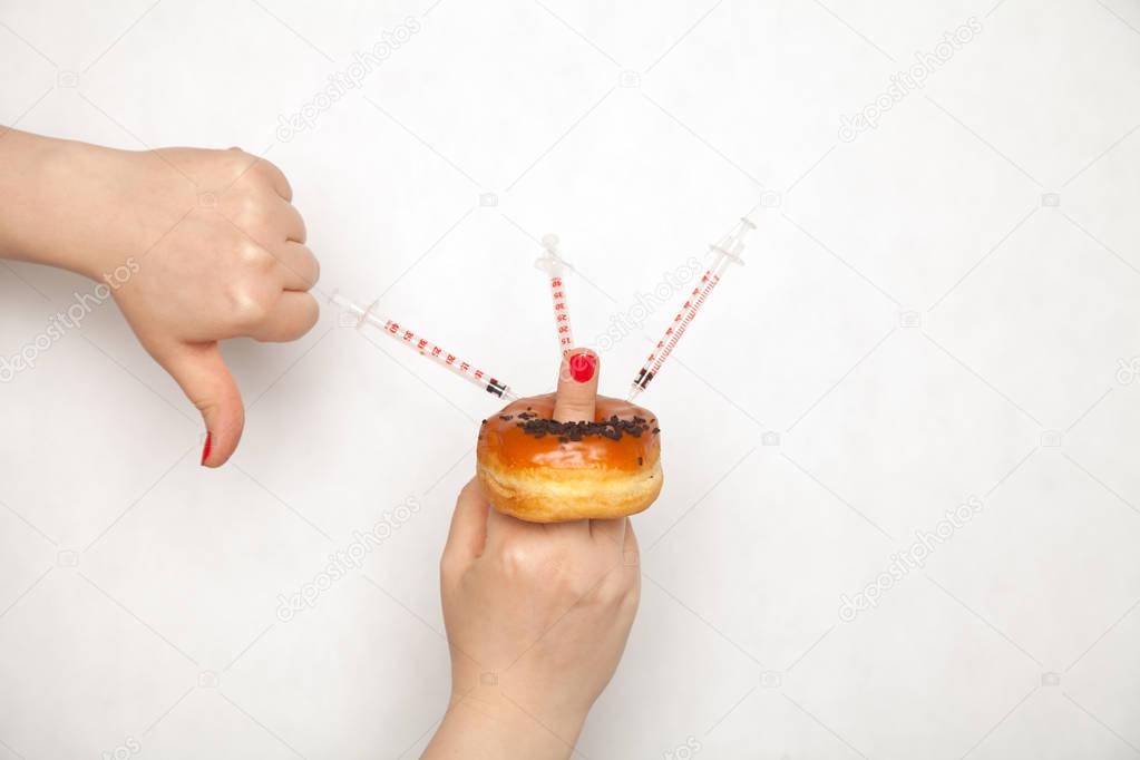 Genetically modified foods, donut pumped with chemicals from a syringe 