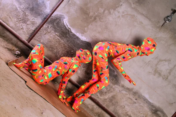 Two orange zentai fetish girl playing — Stock Photo, Image