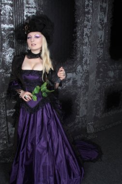 pretty blonde woman wearing historical purple black long dress clipart