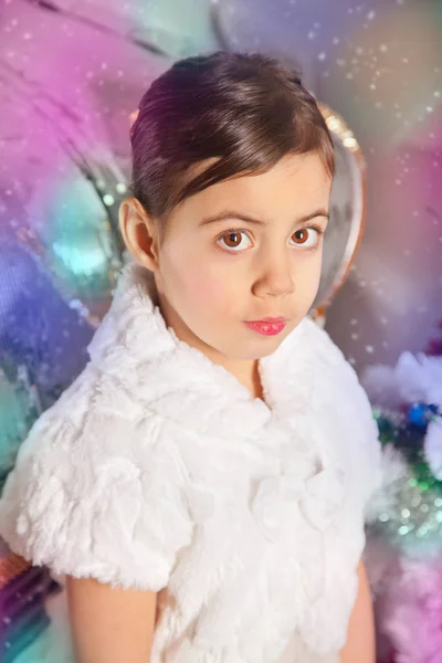 Pretty emotional little kid girl with christmas tree — Stock Photo, Image