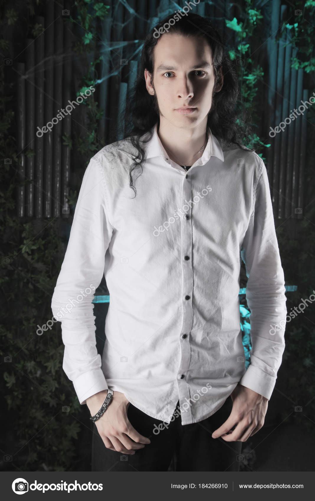 Handsome Manly Guy Long Black Hair Stands White Shirt Dark Stock