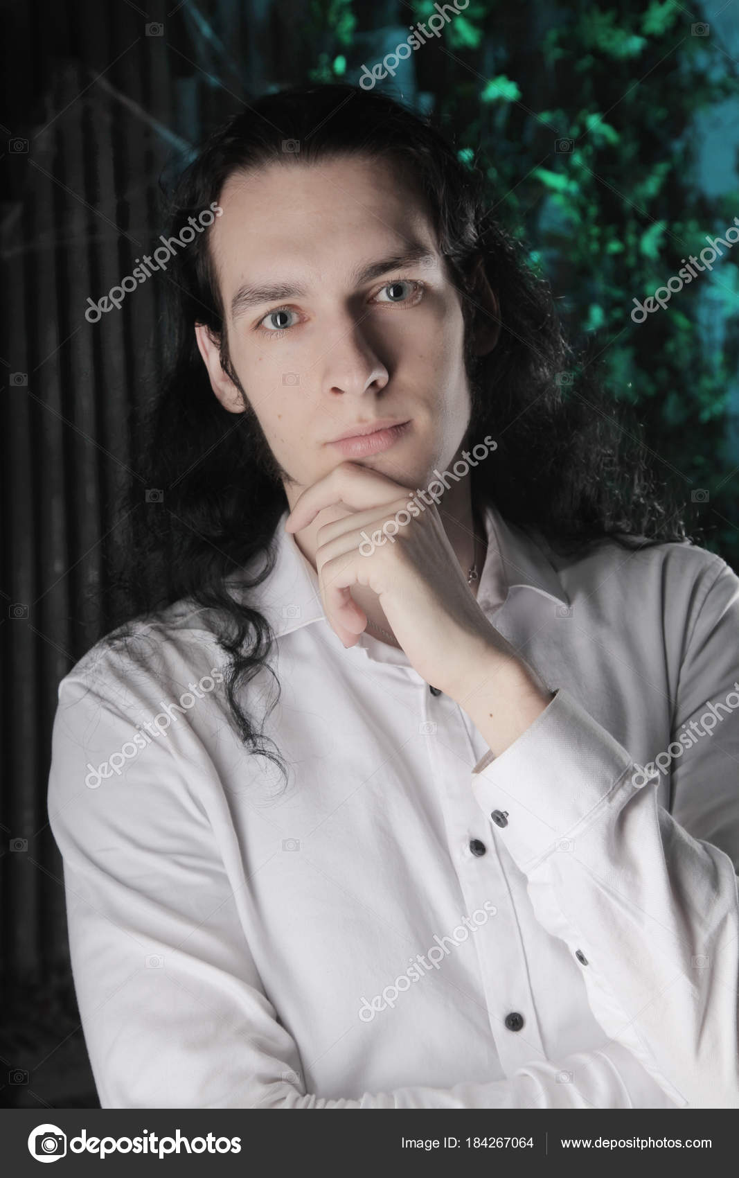 Handsome Manly Guy Long Black Hair Stands White Shirt Dark Stock