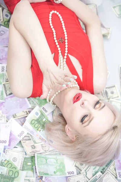 Beautiful Blonde Woman Red Dress Lying Lot Money Enjoying Life — Stock Photo, Image