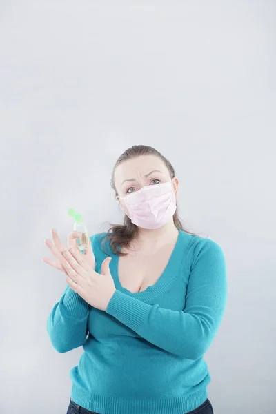 Hand of woman that applying alcohol spray or anti bacteria spray to prevent spread of germs, bacteria and virus. Personal hygiene concept