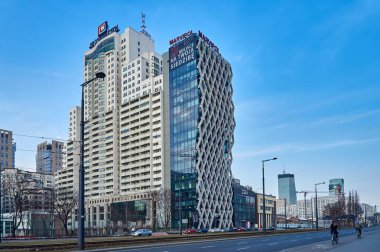 Warsaw, Poland - March 05, 2017: Prosta Tower office building is a neomodern office building, combines elegance and functionality, in the most prestigious office location in Warsaw. clipart