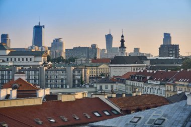 Warsaw, Poland - August 11, 2017: Beautiful panoramic view over the roofs of the Old Town to the Center of Warsaw, the Palace of culture and science (PKiN), modern skyscrapers and Krakowskie Przedmies clipart