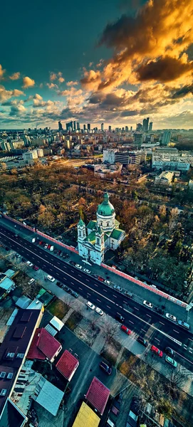 Beautiful panoramic aerial drone view to the ?enter of modern Warsaw city with silhouettes of skyscrapers and Church Karol Boromeusz (at the Powazki Cemetery) in amazing winter January sunset, Poland — Stock Photo, Image