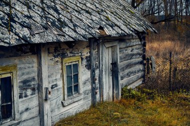 A terrible mysterious apocalyptic view: an abandoned house in the abandoned Belarusian Kovali (Belarusian: blacksmiths) village - no one lives here anymore clipart