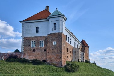 Beautiful panoramic aerial drone view to the Sandomierz Royal Castle - medieval structure in Sandomierz, Poland - was built on a slope of Vistula River by Casimir III the Great in the 16th century