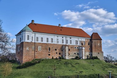 Beautiful panoramic aerial drone view to the Sandomierz Royal Castle - medieval structure in Sandomierz, Poland - was built on a slope of Vistula River by Casimir III the Great in the 16th century