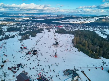 Beautiful panoramic aerial drone view to the ski slopes with lifts in the Bialka Tatrzanska ski resort Tatra Mountains (Tatras, Tatra) - mountain range between Slovakia and Poland, PL clipart