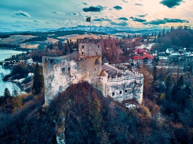 Beautiful panoramic aerial drone view to the Niedzica Castle also known as Dunajec Castle, located in the southernmost part of Poland in Niedzica, Nowy Targ County, Dunajec River, Lake Czorsztyn, PL clipart