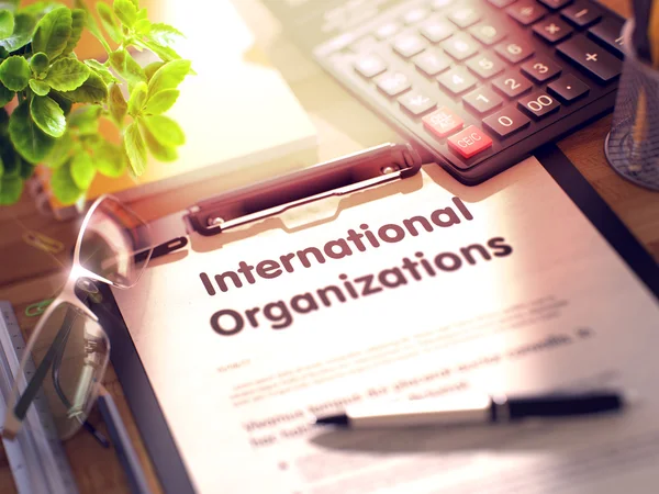 Portapapeles con el concepto de organizaciones internacionales. 3D . — Foto de Stock