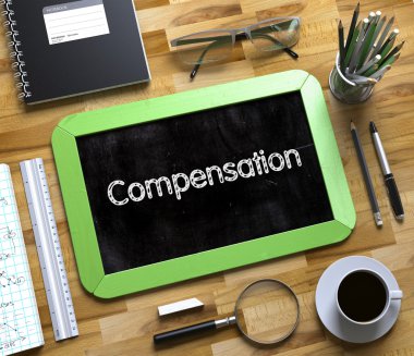 Compensation - Text on Small Chalkboard. 3D. clipart