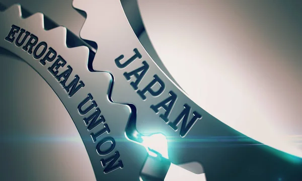 Japan European Union - Text on Mechanism of Shiny Metal Cog Gear — Stock Photo, Image