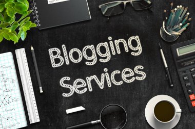 Blogging Services - Text on Black Chalkboard. 3D Rendering. clipart